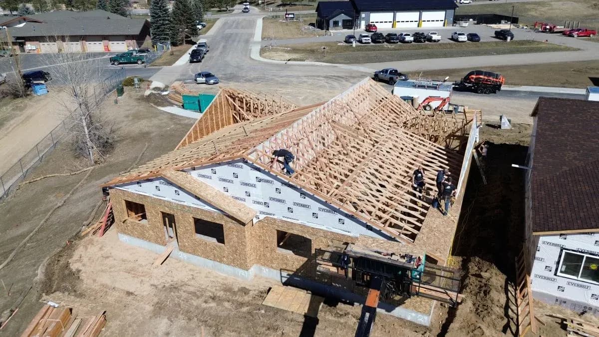 Aerial view of residential stick framing and roof truss construction in Sheridan, Wyoming