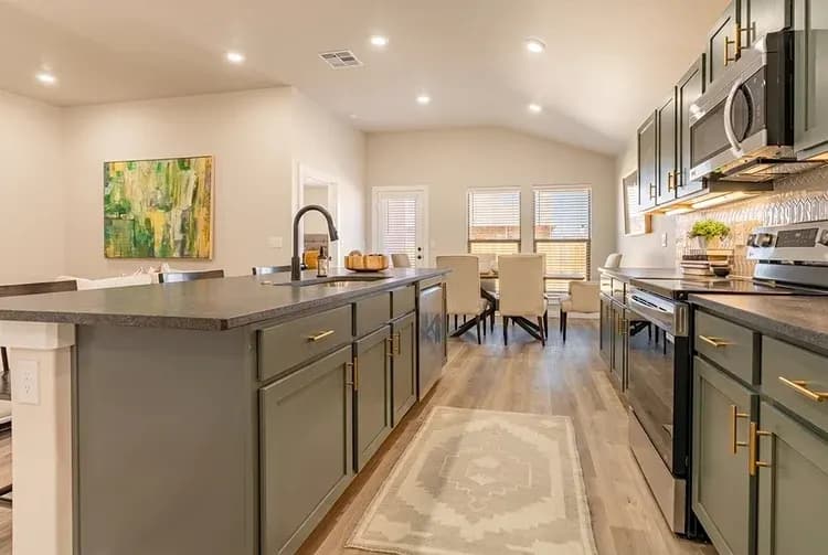 Kitchen and dining area in The Big Horn home model by Buffalo Built LLC.