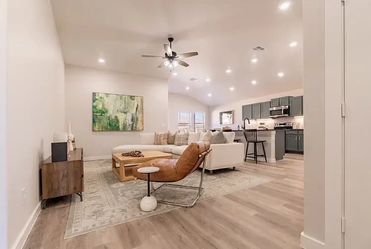 Living room and kitchen, alternate view, in The Big Horn home model by Buffalo Built LLC.