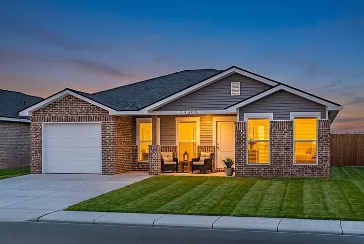 Exterior of The Black Tooth home model at dusk by Buffalo Built LLC.