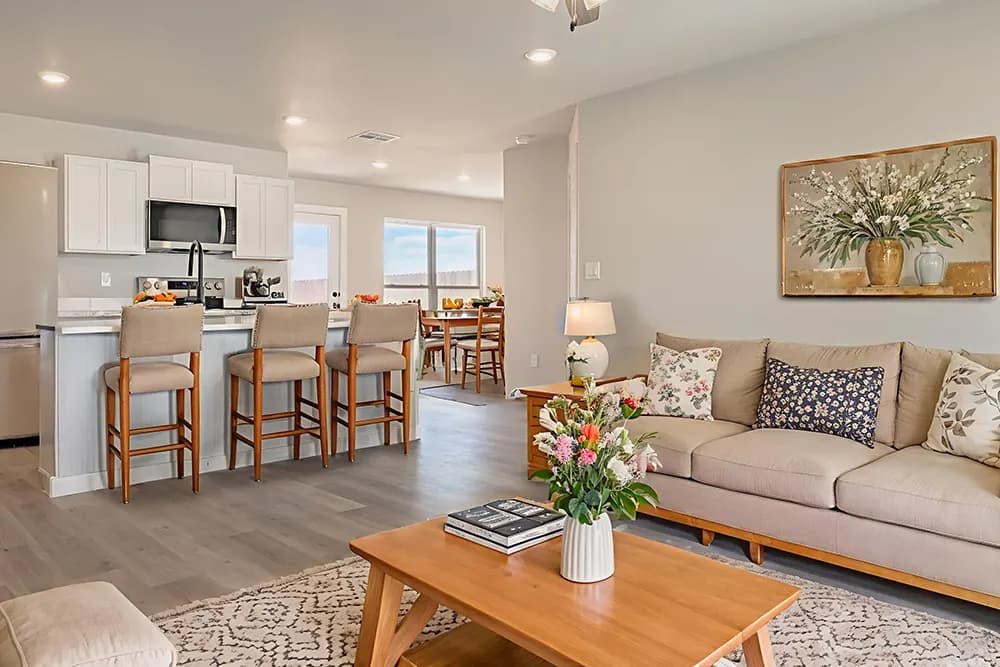 Open living room, kitchen, and dining area in The Black Tooth home model by Buffalo Built LLC.