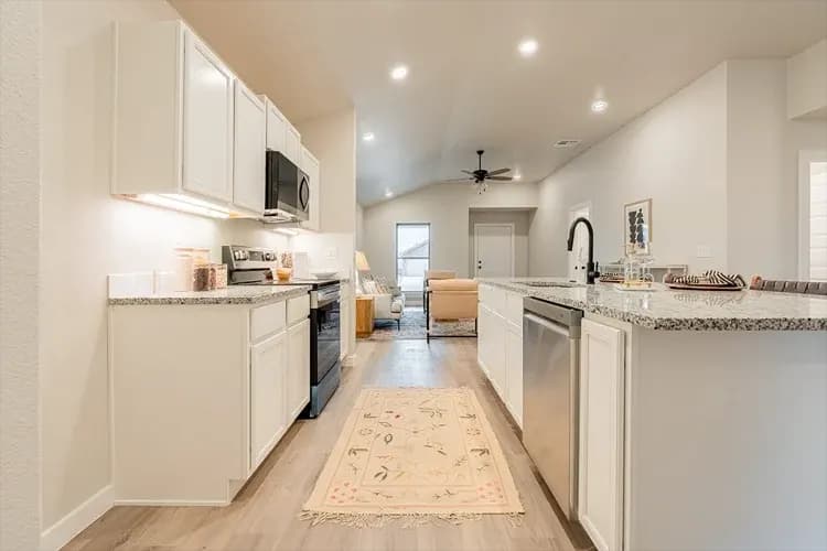 Kitchen, alternate staging, in The Bomber Mountain home model by Buffalo Built LLC.