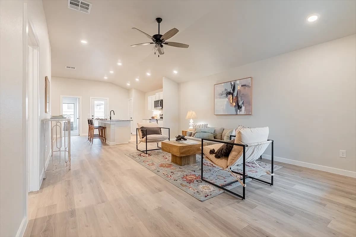 Open living room and kitchen in The Bomber Mountain home model by Buffalo Built LLC.