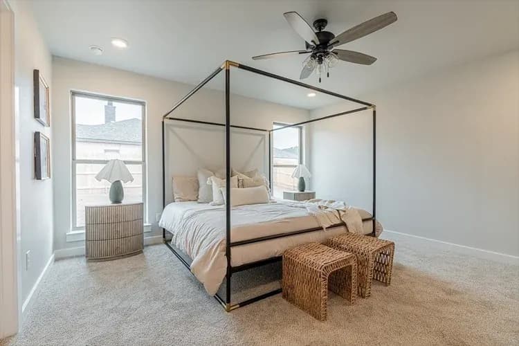 Primary bedroom, alternate view, in The Bomber Mountain home model by Buffalo Built LLC.