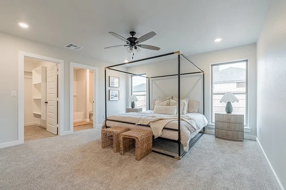 Primary bedroom in The Bomber Mountain home model by Buffalo Built LLC.