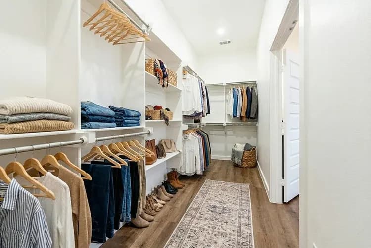 Primary walk-in closet in The Cloud Peak home model by Buffalo Built LLC.