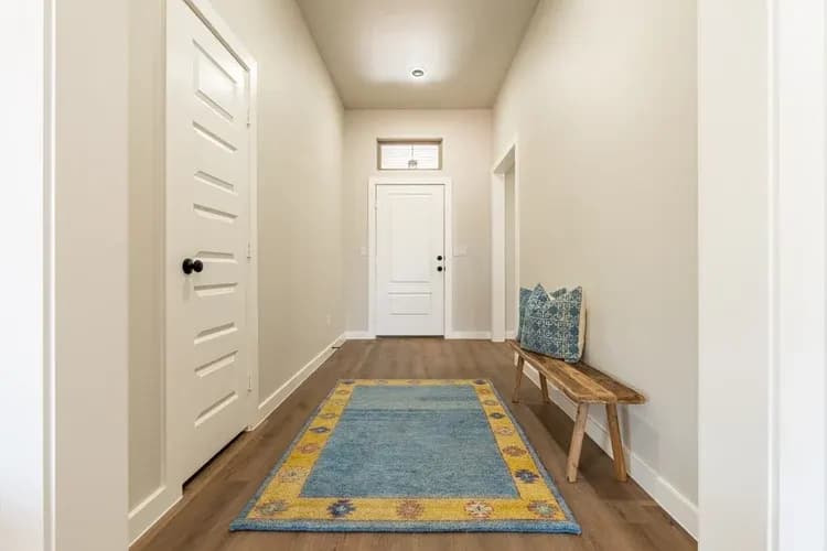 Front entry hallway in The Cloud Peak home model by Buffalo Built LLC.