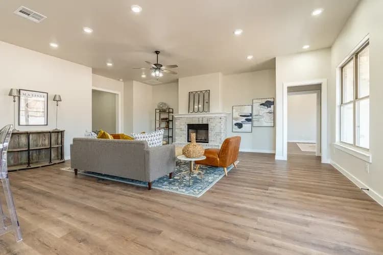 Living room with fireplace, alternate view, in The Cloud Peak home model by Buffalo Built LLC.