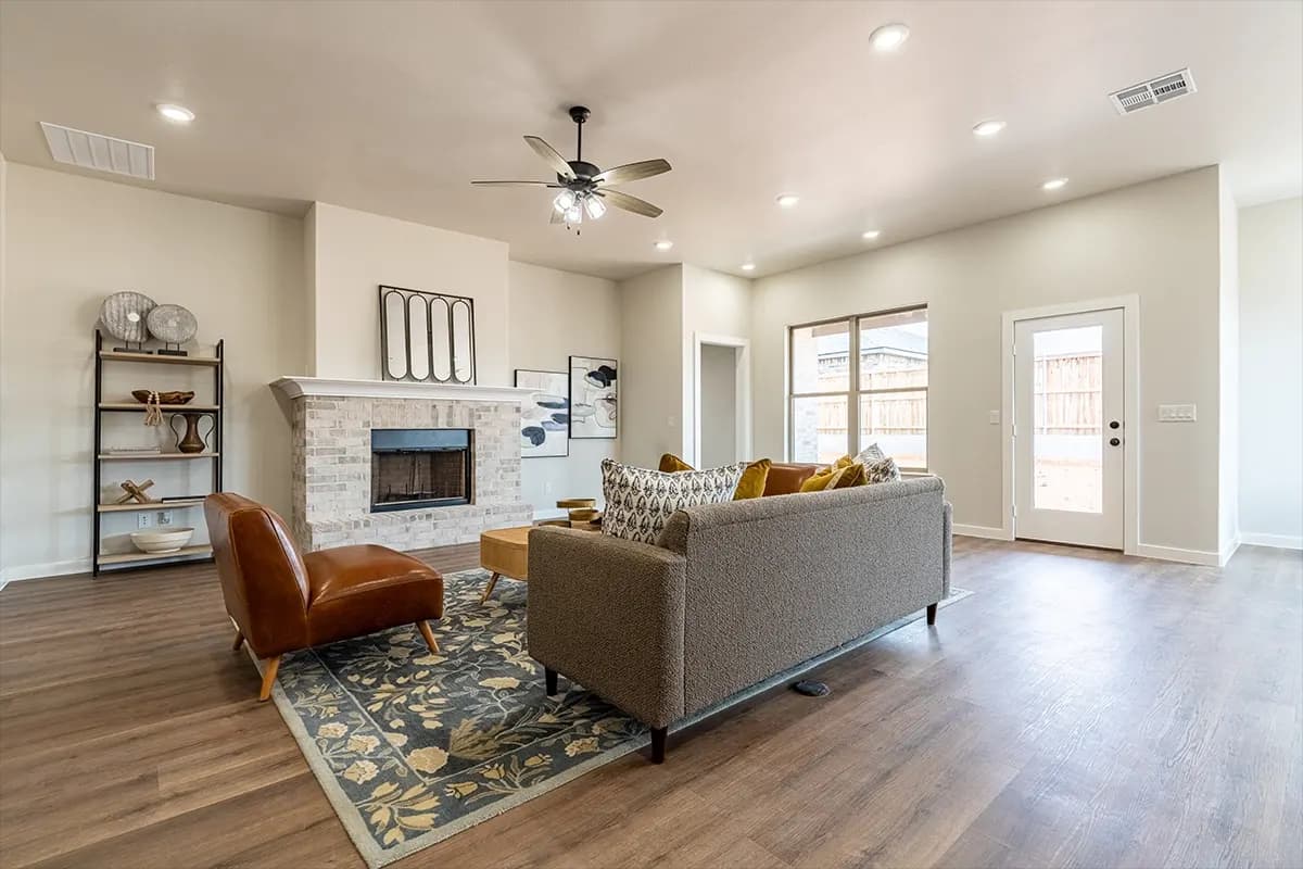 Living room with fireplace in The Cloud Peak home model by Buffalo Built LLC.