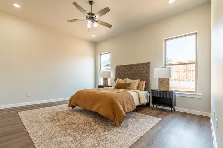Bedroom suite, alternate view, in The Cloud Peak home model by Buffalo Built LLC.