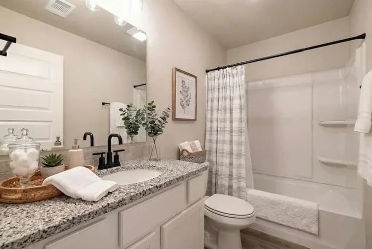 Bathroom, alternate view, in The Crazy Woman home model by Buffalo Built LLC.