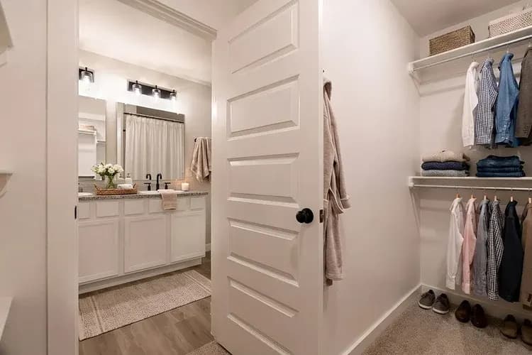 Walk-in closet in The Crazy Woman home model by Buffalo Built LLC.