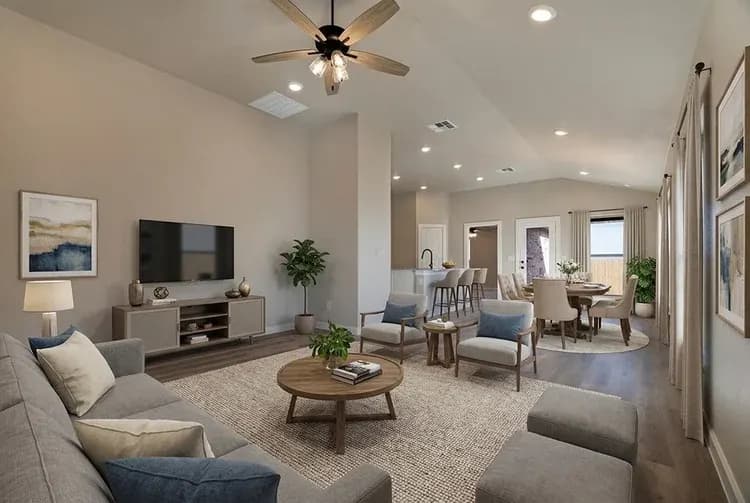 Living room with gray sectional in The Crazy Woman home model by Buffalo Built LLC.