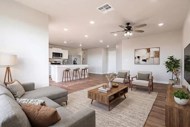 Living room and kitchen, alternate staging, in The DeSmet home model by Buffalo Built LLC.