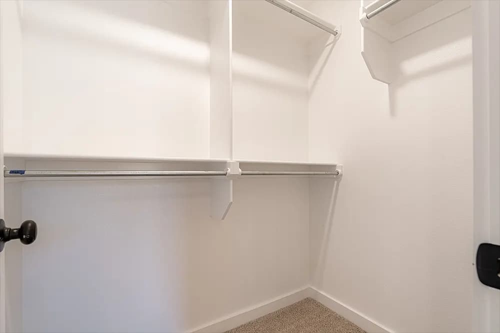 Walk-in closet in The French Creek home model by Buffalo Built LLC.