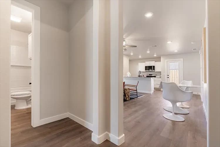 Hallway leading to the living area and bathroom, shared between The French Creek and The Outlaw floor plans by Buffalo Built LLC.