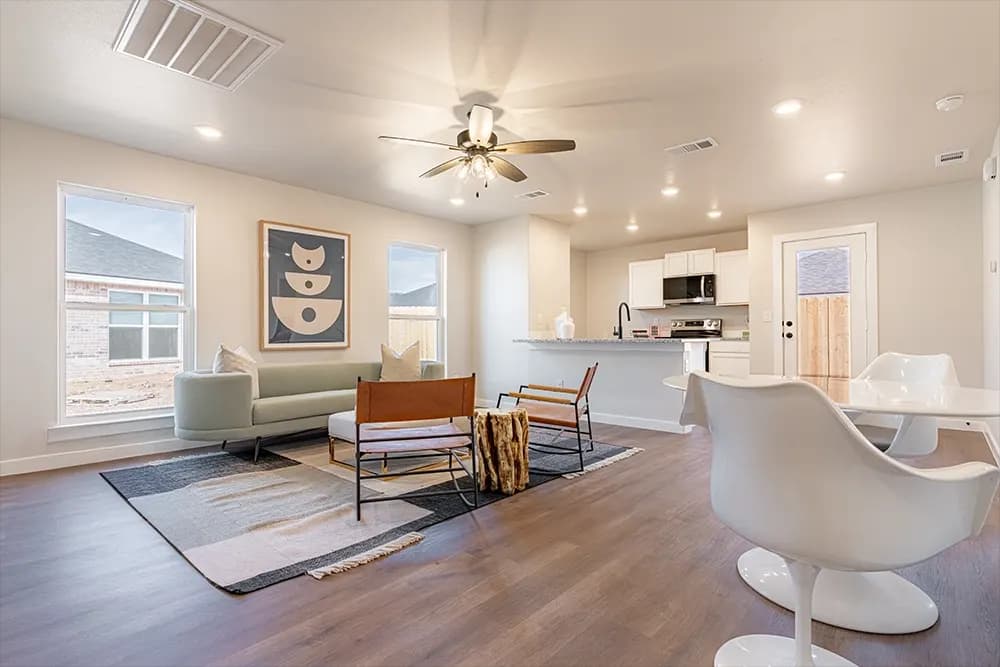Living room and kitchen, alternate view, shared between The French Creek and The Outlaw floor plans by Buffalo Built LLC.