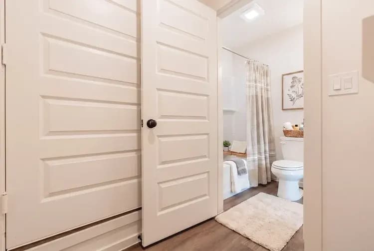 Bathroom viewed from the hallway in The Little Big Horn home model by Buffalo Built LLC.