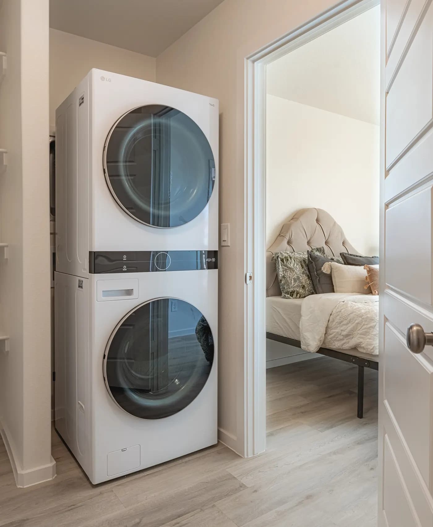 Stacked washer and dryer closet in The Little Big Horn home model by Buffalo Built LLC.
