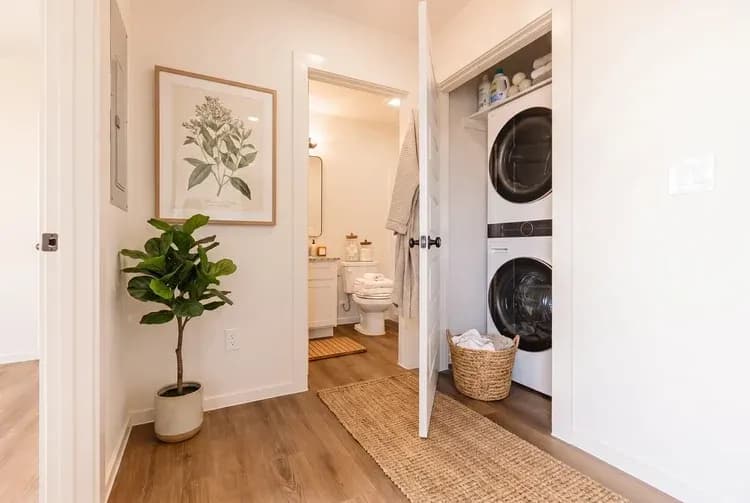 Laundry closet with open door in The Little Big Horn home model by Buffalo Built LLC.