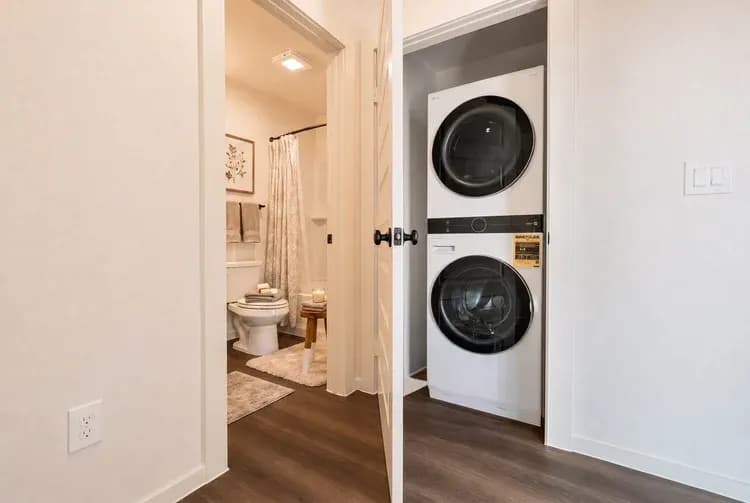 Laundry closet viewed from the hallway in The Little Big Horn home model by Buffalo Built LLC.