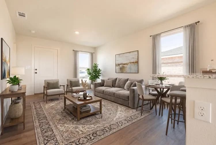 Living room and dining area in The Little Big Horn home model by Buffalo Built LLC.