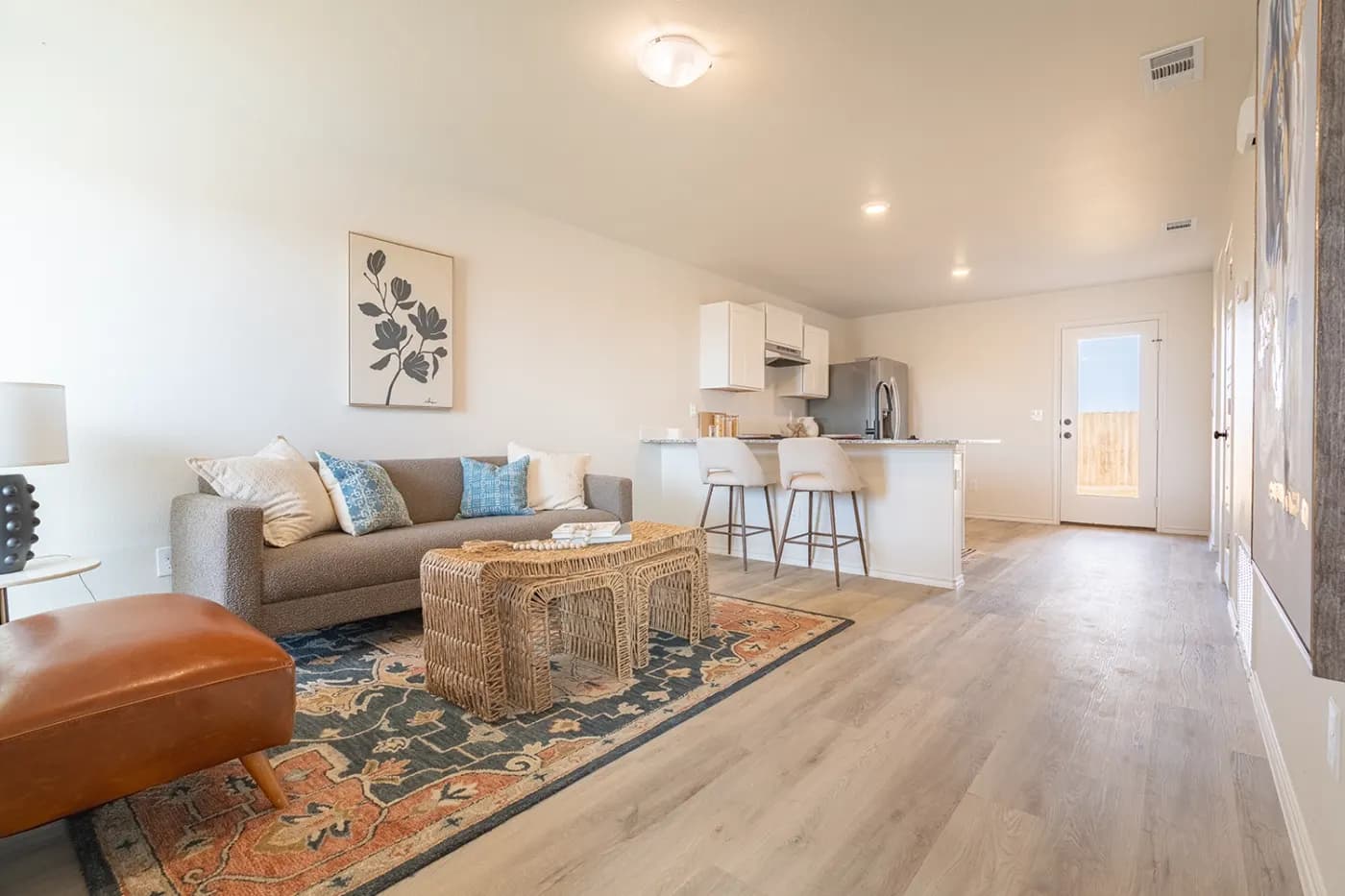 Open living room and kitchen in The Little Big Horn home model by Buffalo Built LLC.