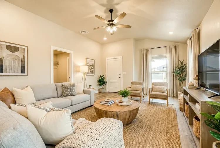 Living room with round coffee table in The Meadow Lark home model by Buffalo Built LLC.
