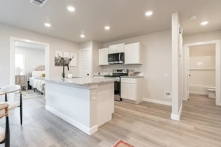 Kitchen viewed from the hallway in The Piney Creek home model by Buffalo Built LLC.