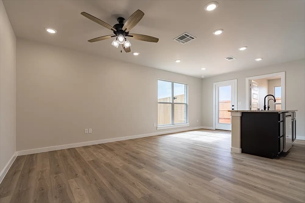 Unstaged living room in The Piney Creek home model by Buffalo Built LLC.