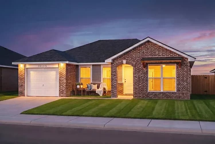 Exterior of The Powder River home model at dusk by Buffalo Built LLC.