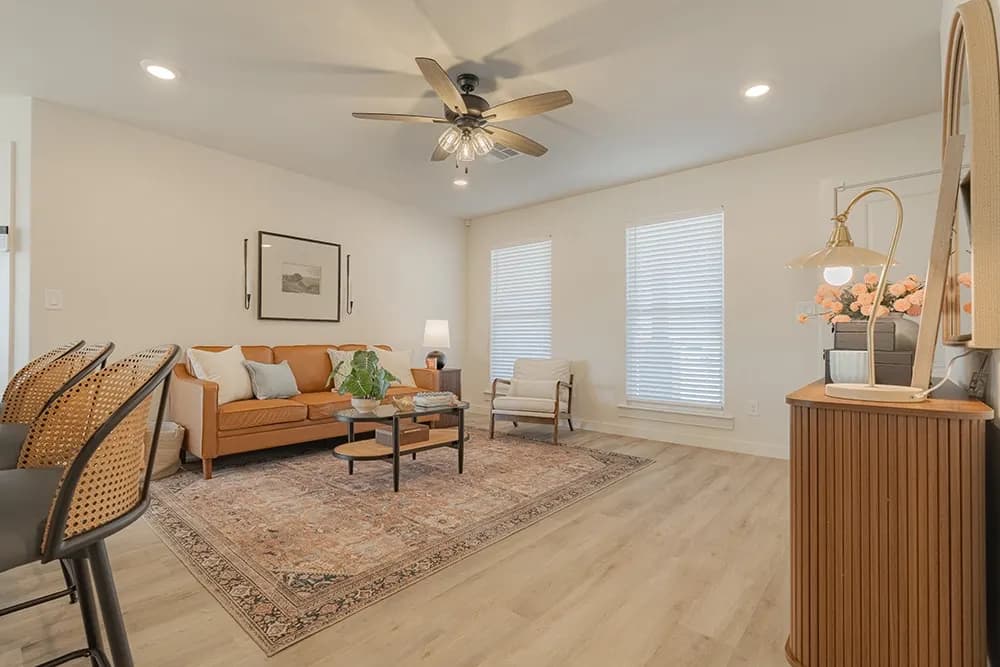 Living room with sofa in The Powder River home model by Buffalo Built LLC.