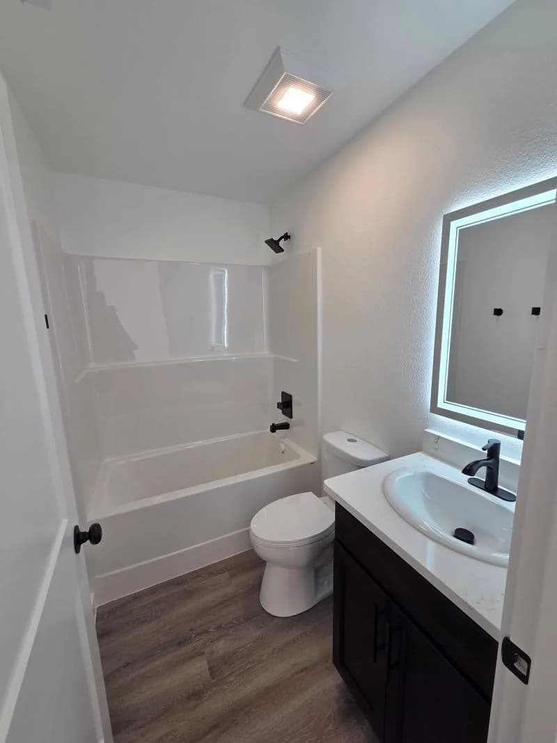 Bathroom 2 with tub and shower in the finished Tie Hack completed home