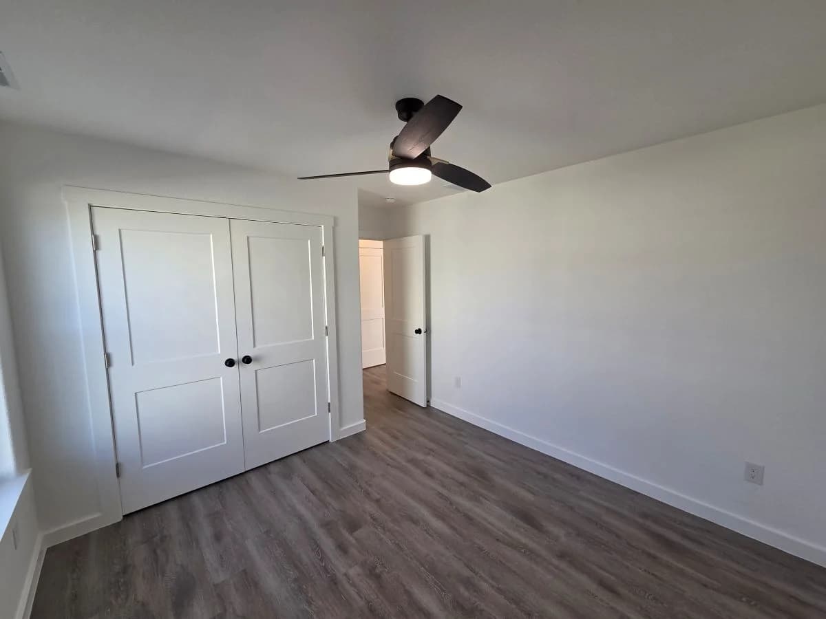 Bedroom 3 with double-door closet in the finished Tie Hack completed home