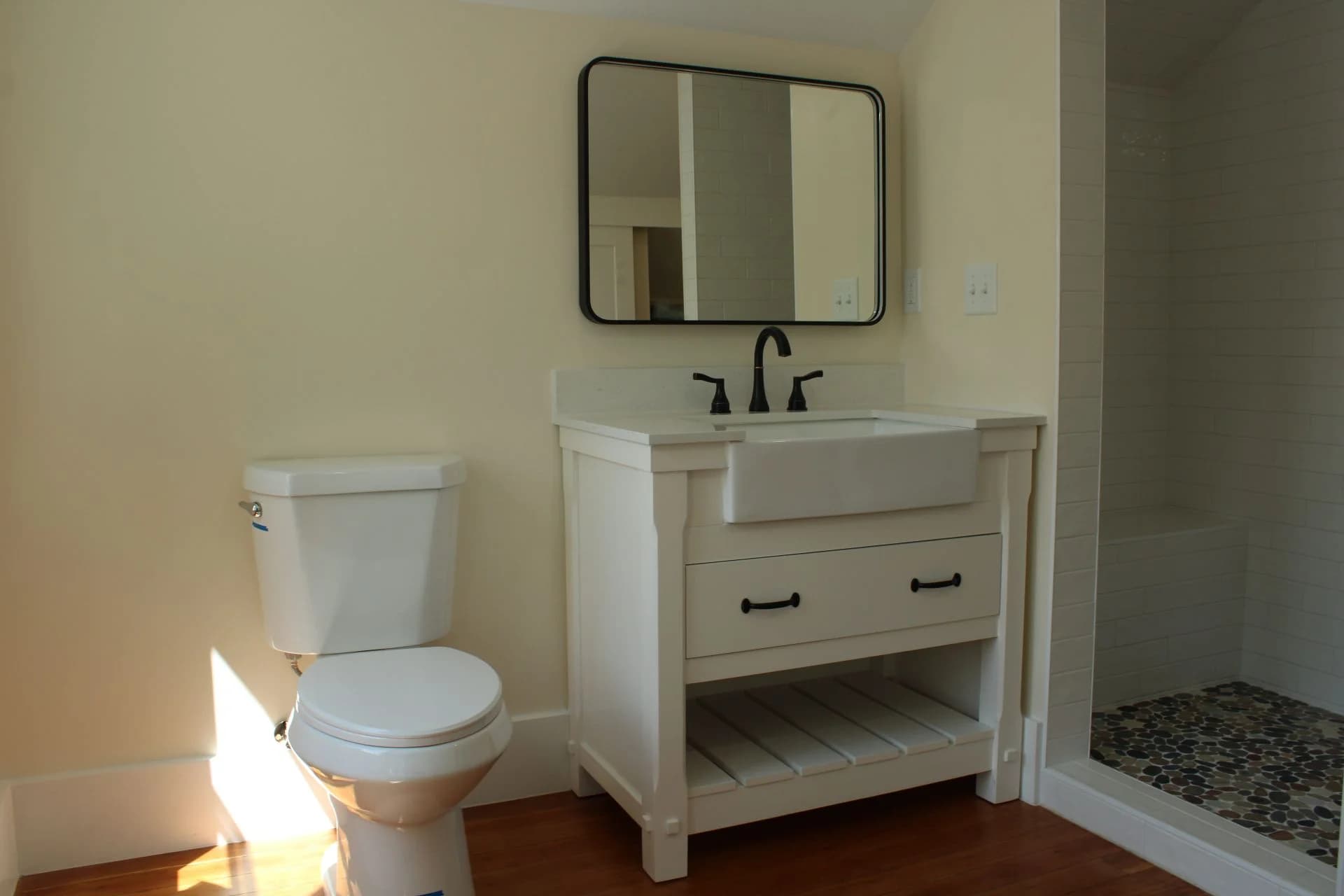 Farmhouse style bathroom remodel with custom vanity and tile by Buffalo Built LLC in Buffalo, WY.