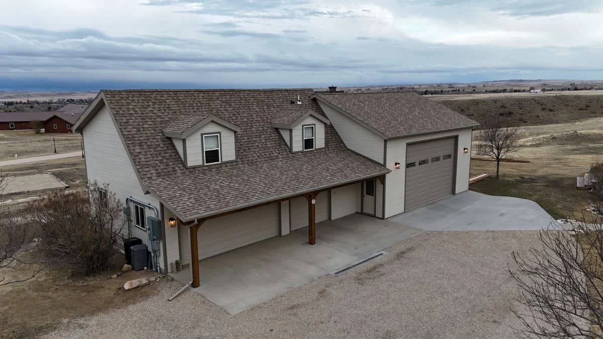 Custom detached garage addition with dormer windows built by Buffalo Built LLC.