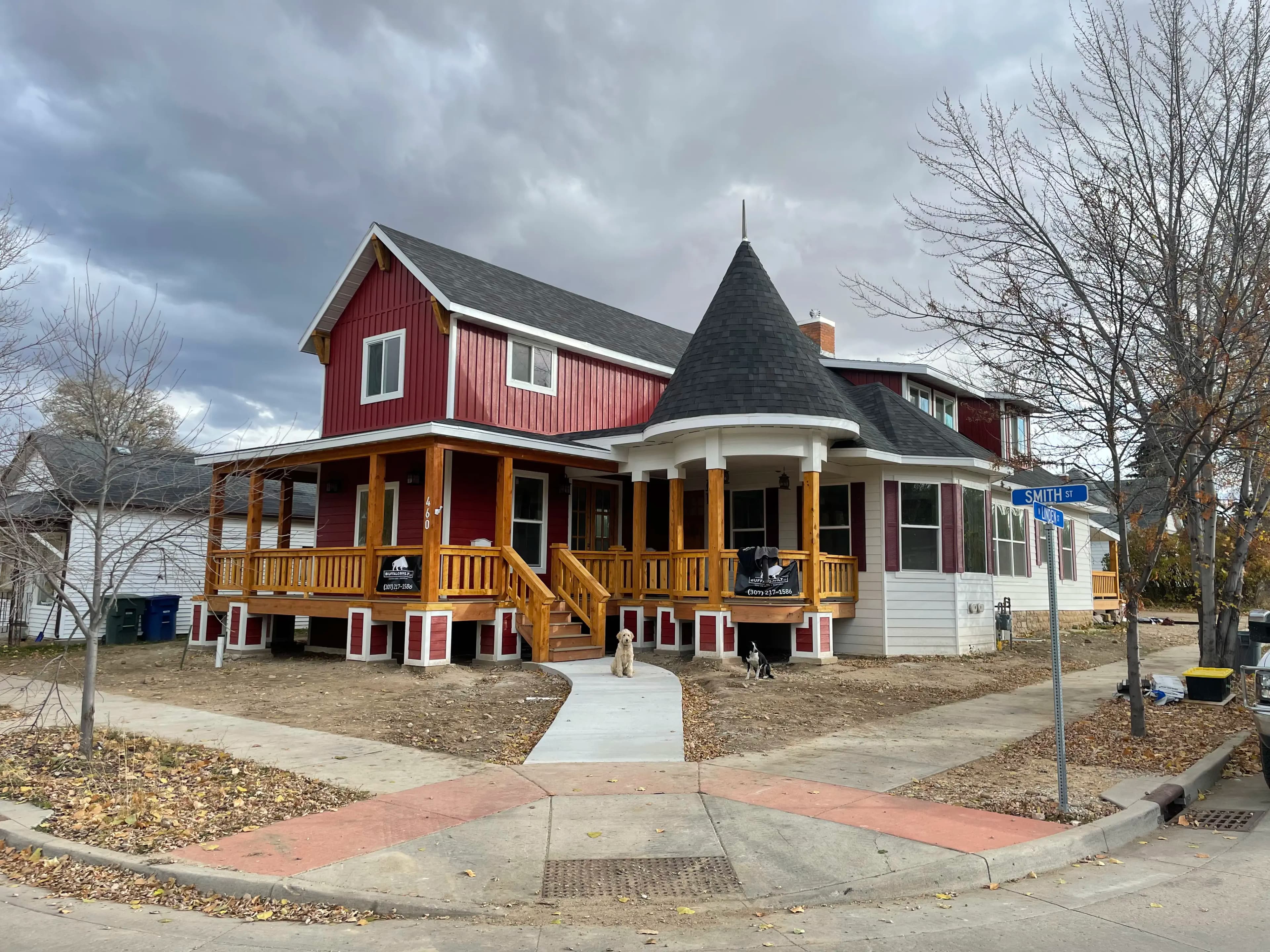 Custom timber frame porch addition with exposed trusses built by Buffalo Built LLC in Sheridan, WY.