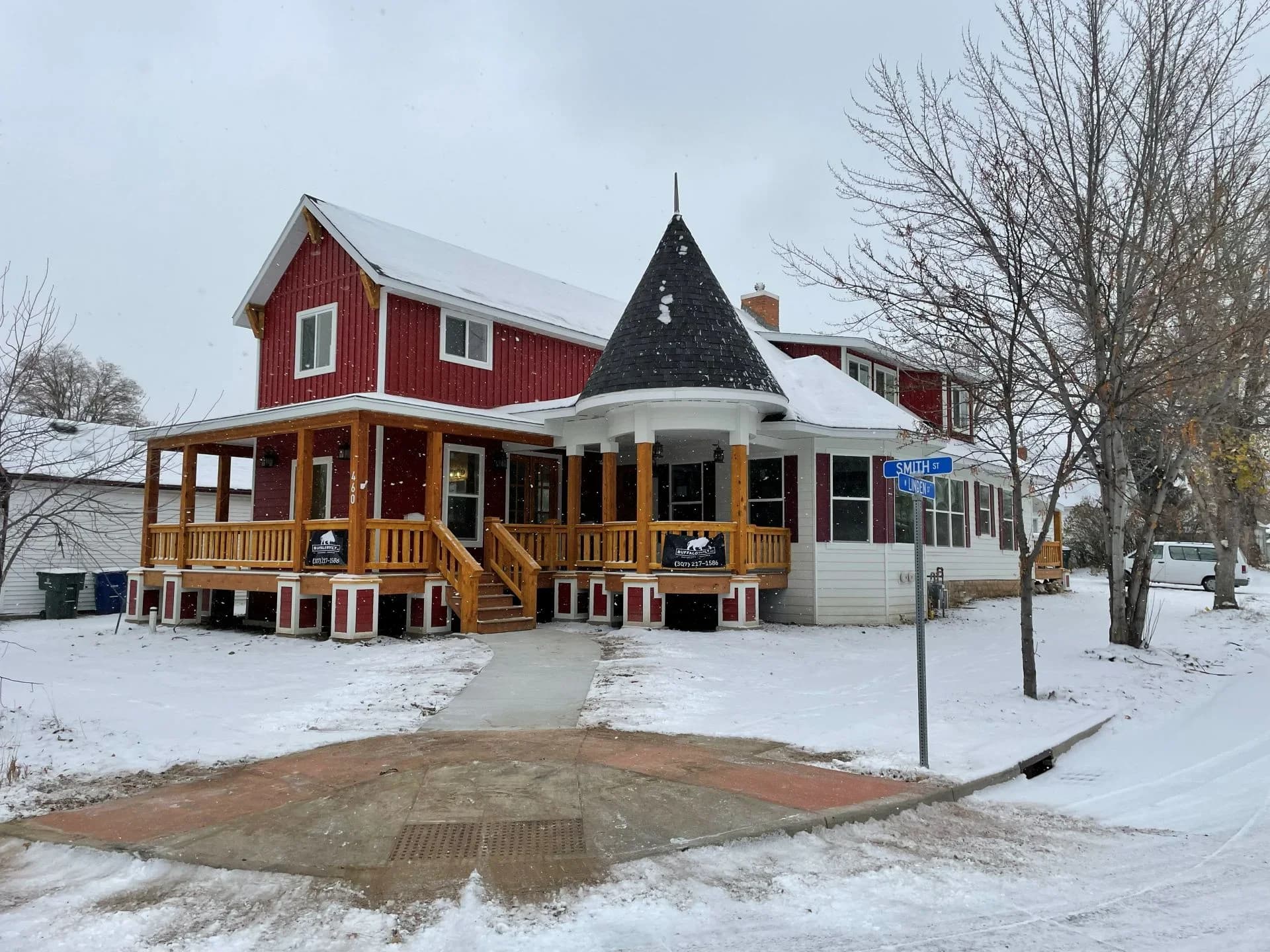 Custom wrap-around covered porch addition built by Buffalo Built LLC in Sheridan, WY.