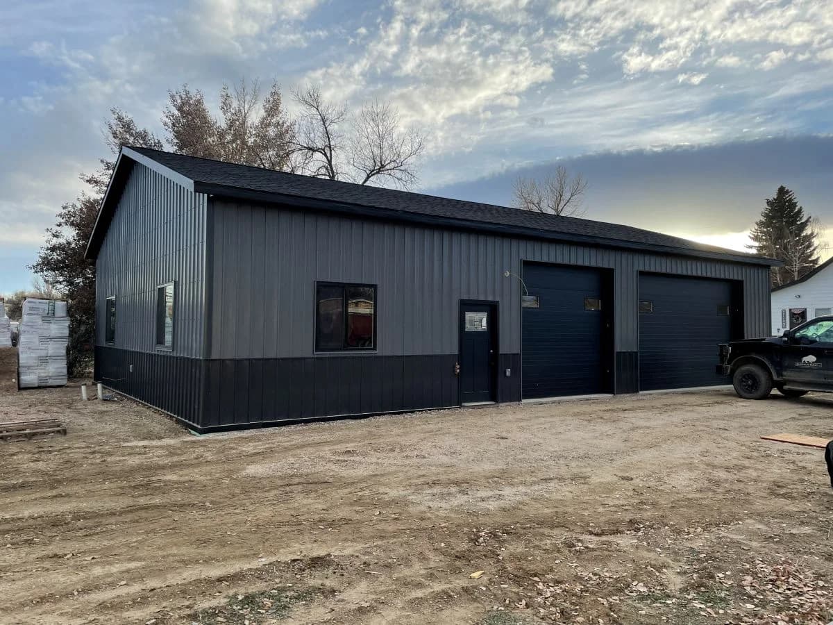 Completed metal shop garage building framed and finished by Buffalo Built LLC in Wyoming.