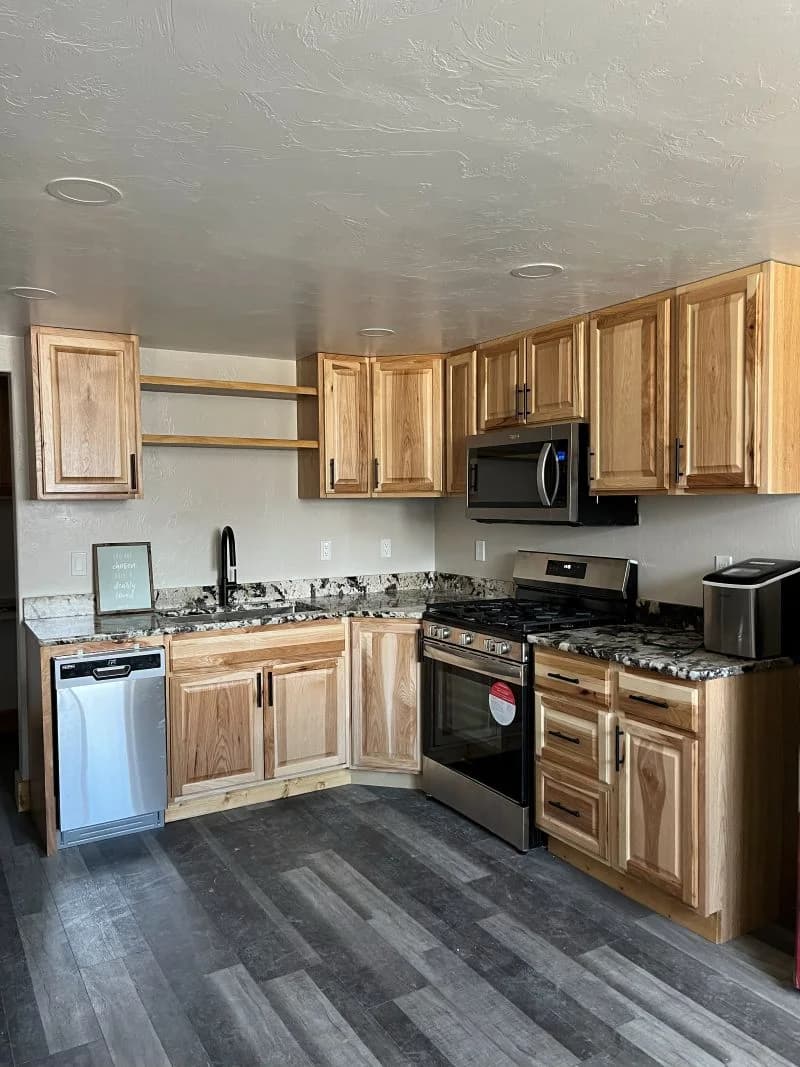 Kitchen remodel featuring custom wood cabinets and new countertops by Buffalo Built LLC in Buffalo, WY.